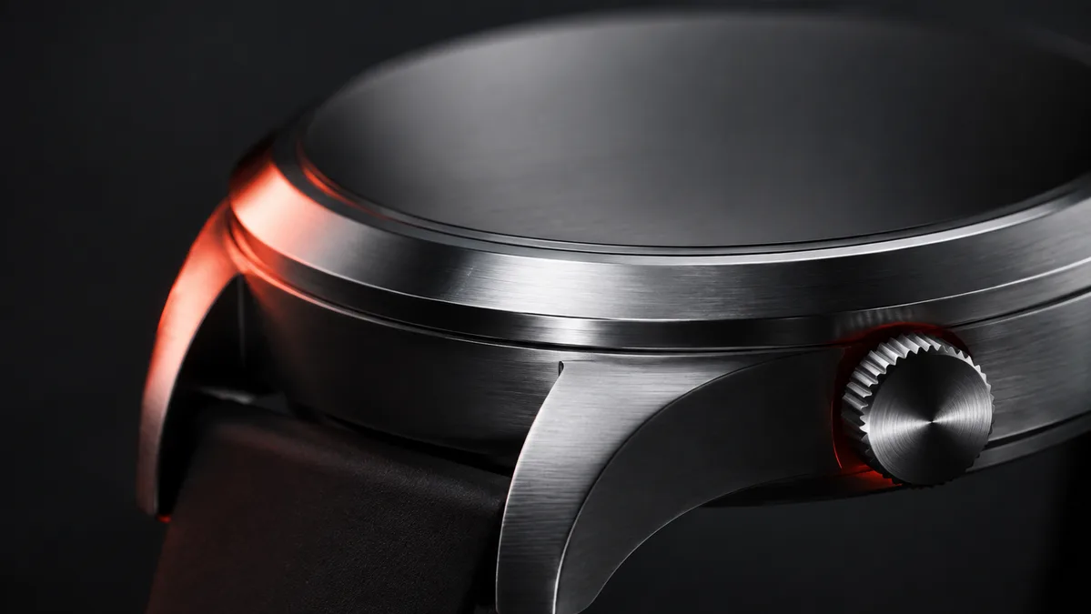 Brushed metal edges and fine grooves in a studio close-up.