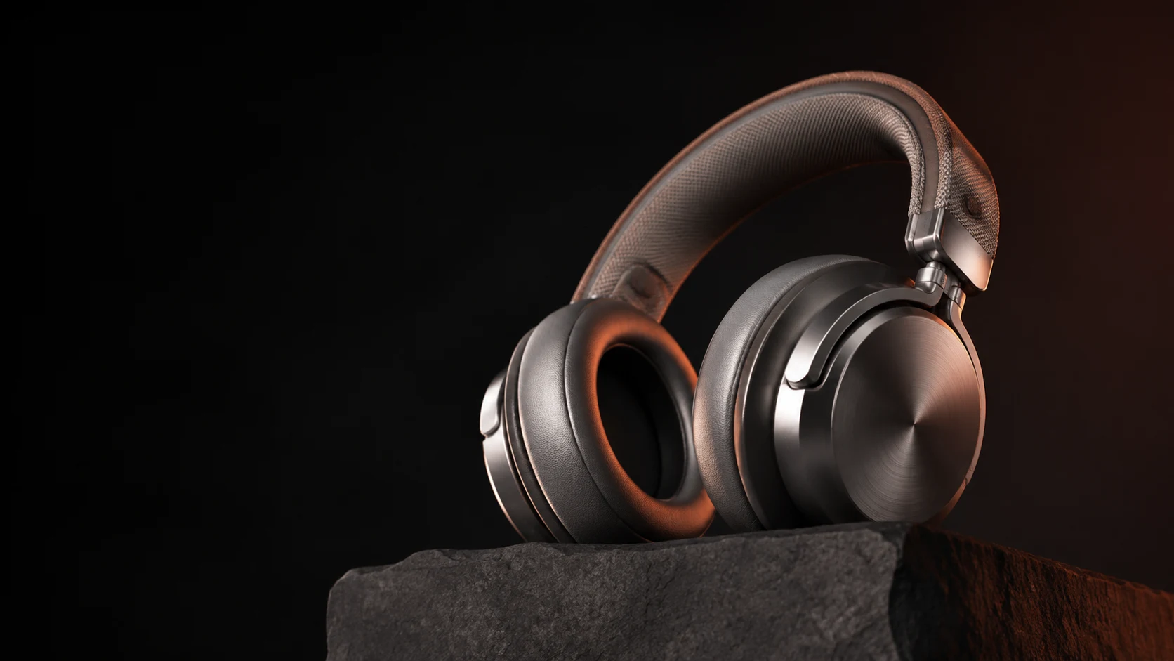 AI-created titanium headphones showing fine brushed metal and fabric detail under warm studio light.